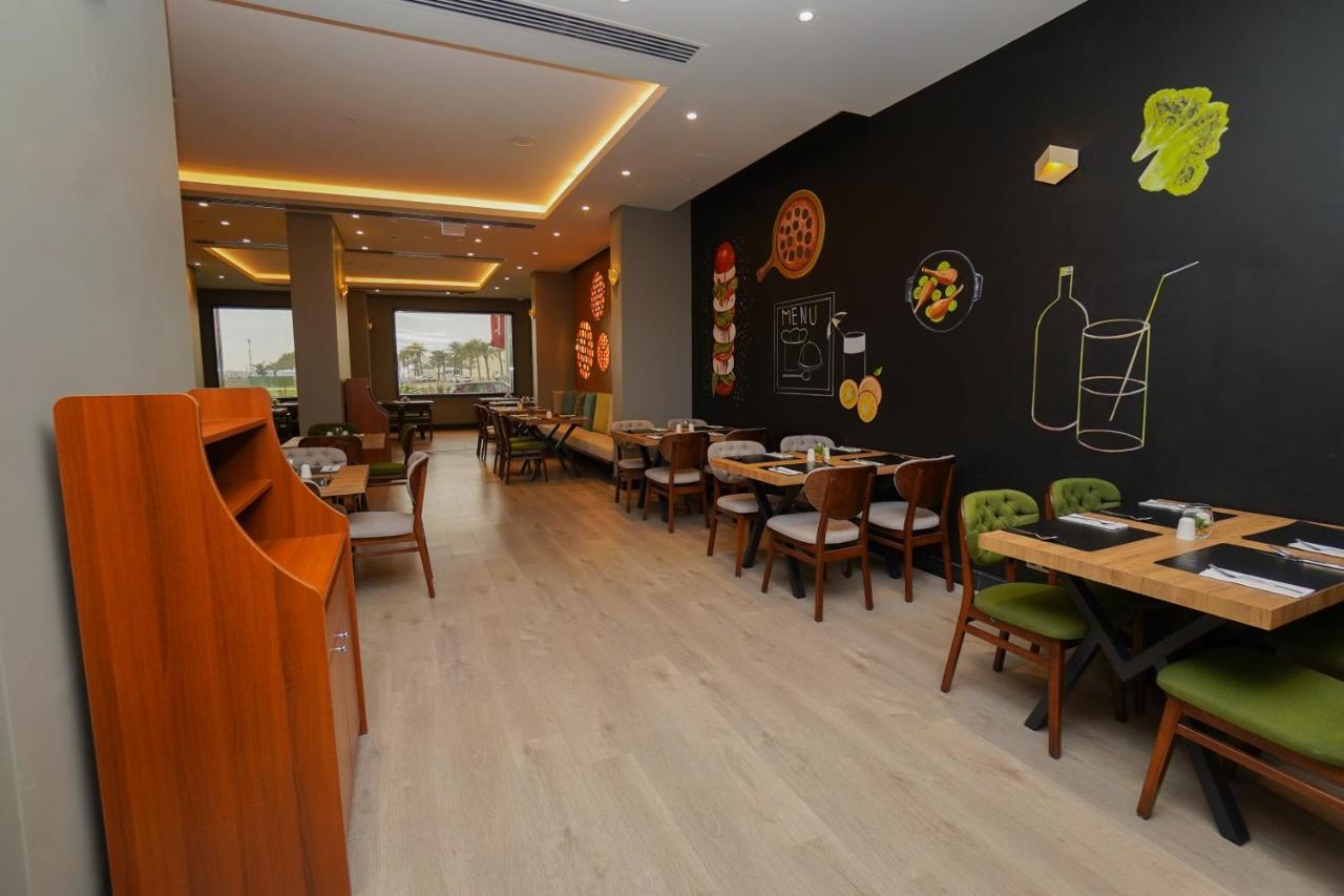 The Grand Lux Hotel Ad Dawhah Esterno foto Interior of a restaurant in Cairo, Egypt